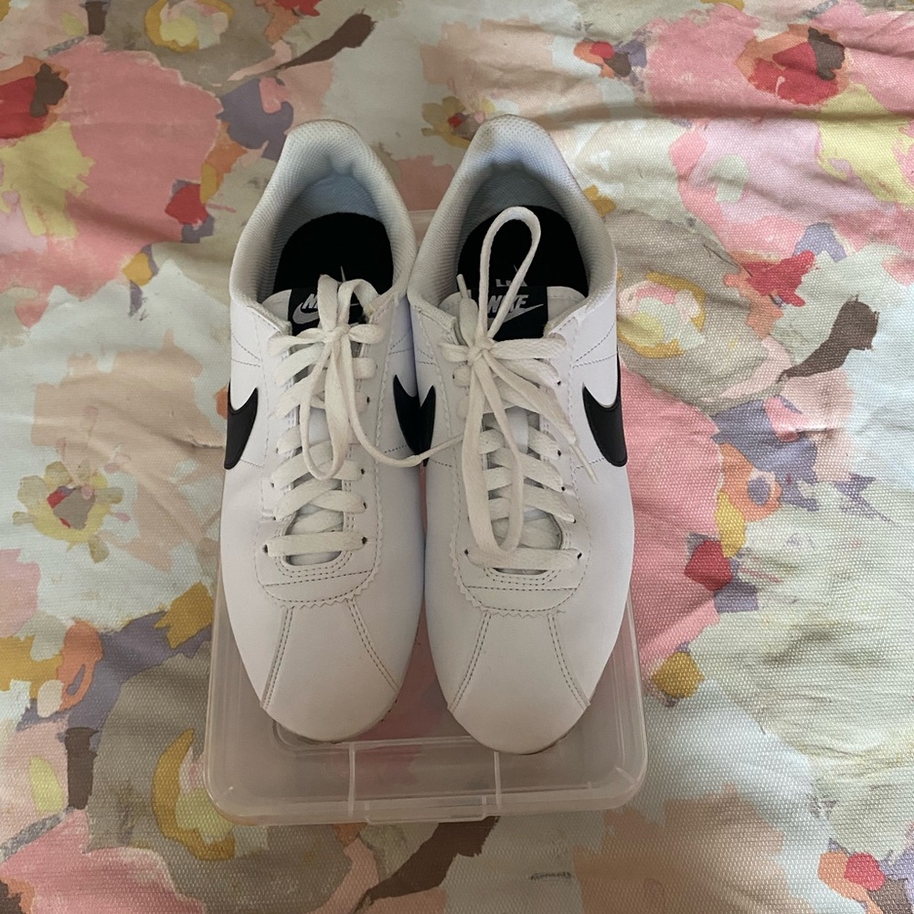 Who’re and black check Nike Cortez